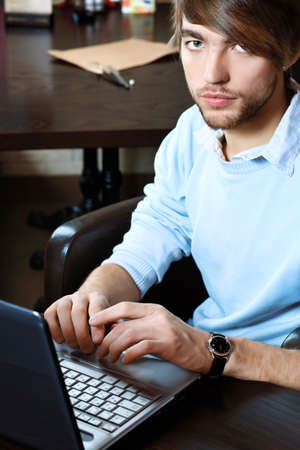 Young business man having a break at a cafの写真素材