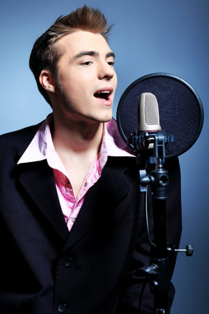 Young man is singing rock'n'roll.