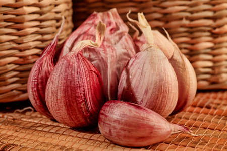 Fresh garlic on a bamboo mat.の写真素材