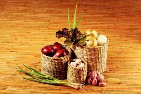 Rural composition with fresh greens, garlic and onionsの写真素材