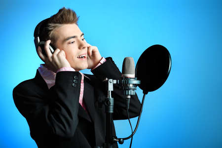 Young man is singing rock'n'roll.の写真素材