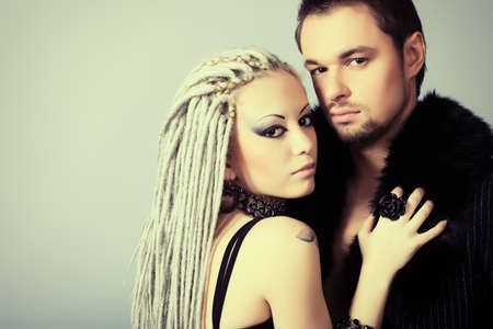 Shot of a passionate loving couple. Over grey background.の写真素材