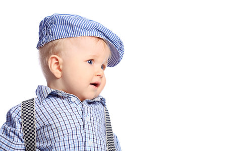 Beautiful little boy. Shot in a studio. Isolated over white background. の写真素材