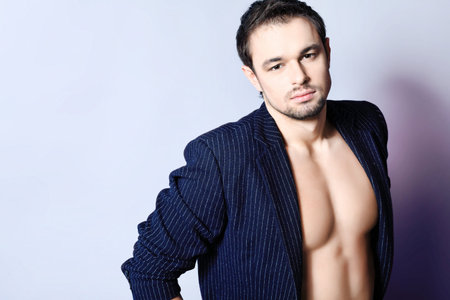 Portrait of a handsome muscular young man. Shot in a studio.の写真素材