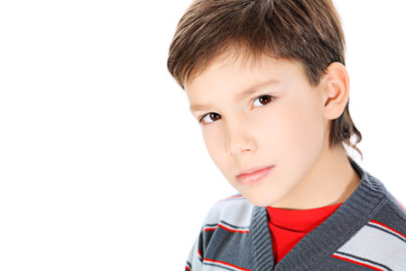Portrait of a 9 year boy. Isolated over white background.