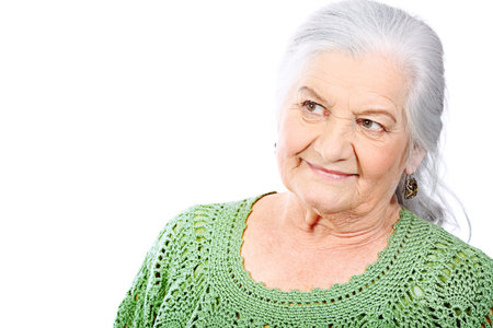 Portrait of a smiling senior woman. Isolated over white background.