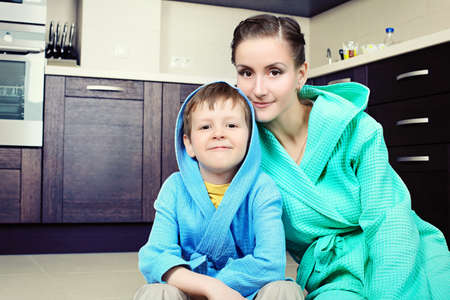 Happy mother with her son at home.の写真素材