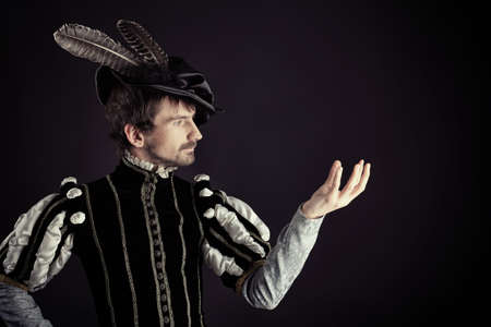 Portrait of a handsome man grandee in 16th century costume. Shot in a studio.の写真素材