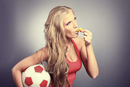 Shot of a sporty young woman with a ball. Active lifestyle, wellness.の写真素材