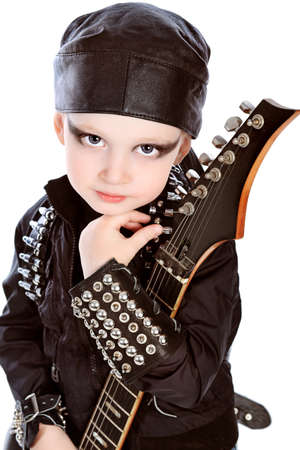 Shot of a little boy playing rock music with electric guitar. Isolated over white background.の写真素材