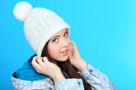 Happy girl teenager over blue background.の写真素材