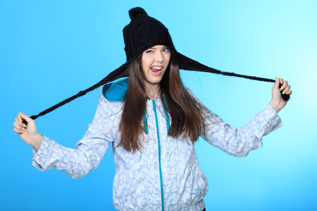 Happy girl teenager over blue background.の写真素材