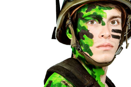 Shot of a conceptual soldier painted in khaki colors. Isolated over white background.の写真素材