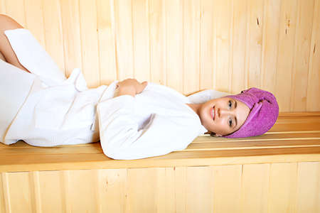 Beautiful young woman relaxing in the sauna. Beauty, healthcare.の写真素材