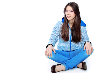 Portrait of a girl teenager. Isolated over white background.の写真素材