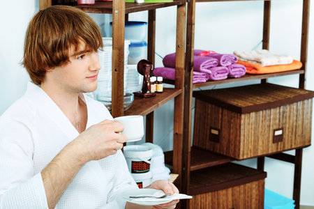 Handsome young man at a  spa salon. Beauty, healthcare.の写真素材