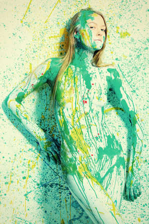 Art project: beautiful woman painted with many vivid colors. の写真素材