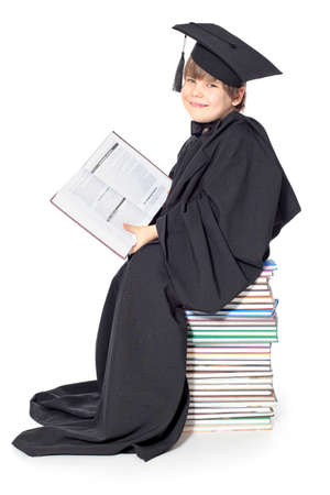 Cute little boy in graduation gownの写真素材