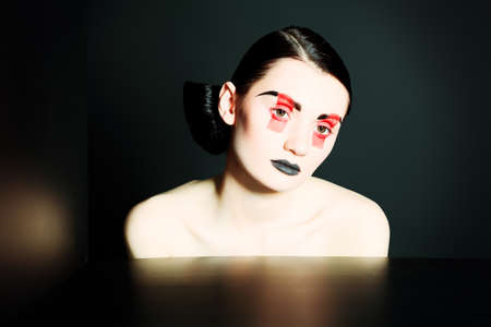 Fashion shot of an attractive model. Make-up. Shapes concept.の写真素材