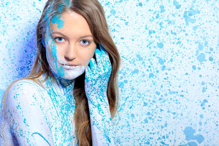 Art project: beautiful woman painted with many vivid colors. の写真素材