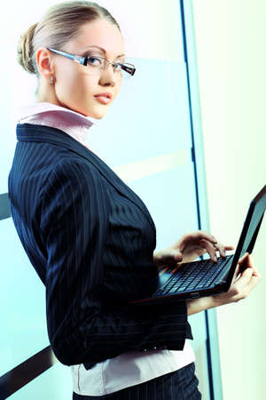 Beautiful business woman is working at the office.の写真素材