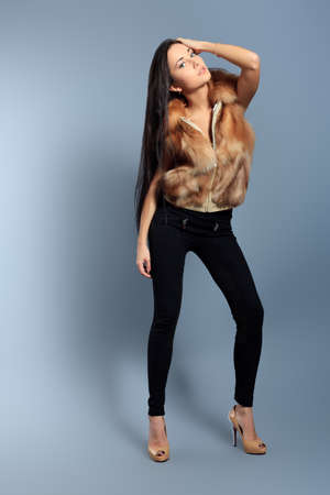 Portrait of a beautiful young woman in a fur.の写真素材