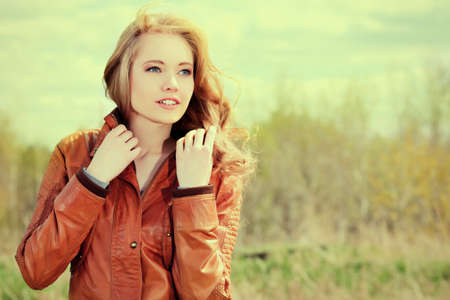 Beautiful young woman outdoors over blue sky.の写真素材