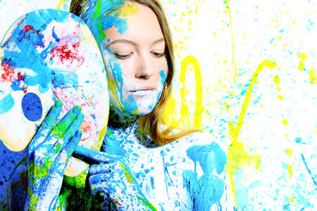 Art project: beautiful woman painted with many vivid colors. の写真素材