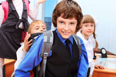Happy children in a class at school.の写真素材
