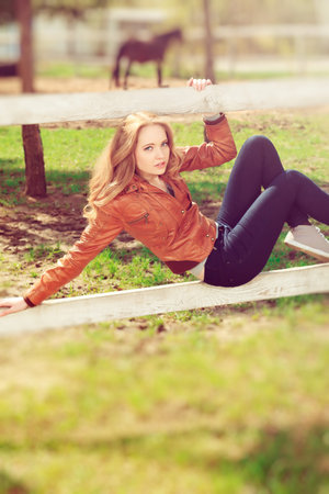 Beautiful smiling young woman outdoors.の写真素材