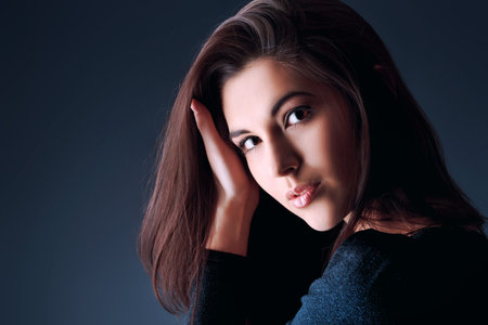 Portrait of a beautiful young woman brunette.