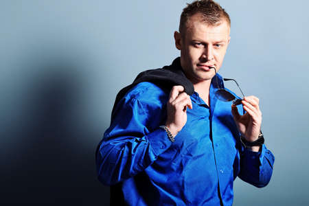 Portrait of a handsome man in a suit. Studio shot.の写真素材