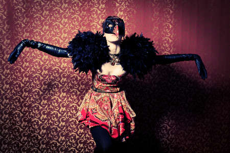 Fashion shot of a beautiful model over vintage background.の写真素材