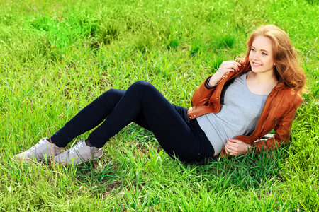 Beautiful smiling young woman outdoors.の写真素材