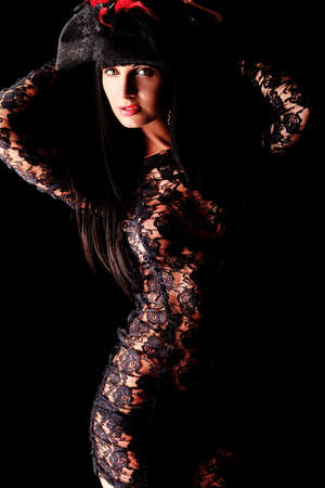 Shot of a sexy woman in erotic lingerie over black background.の写真素材