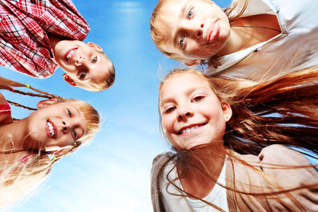 Group of happy children having fun outdoors.