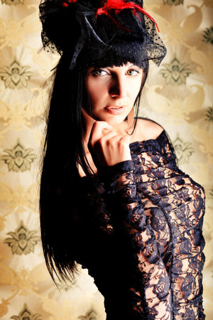 Shot of a sexy woman in erotic lingerie over vintage background.