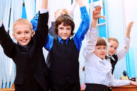 Happy children in a class at school.の写真素材