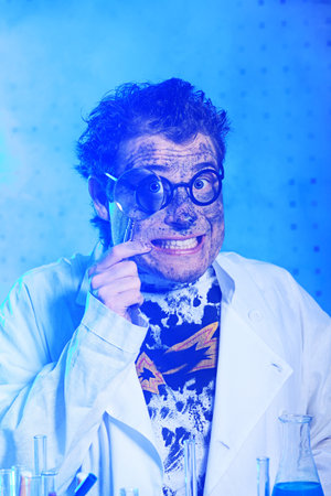 Medical theme: funny crazy scientist is working in a laboratory.の写真素材