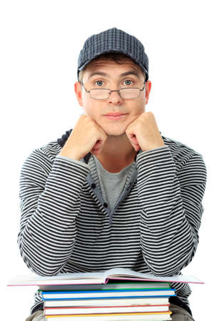 Educational theme: male student with books. Isolated over white background.の写真素材