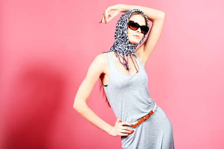 Portrait of an attractive young woman in sunglasses. Retro style.の写真素材