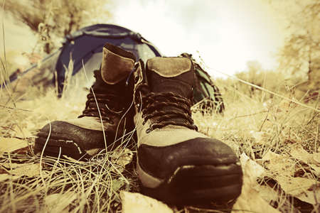 Tourist boots in front of a tent outdoor.の写真素材