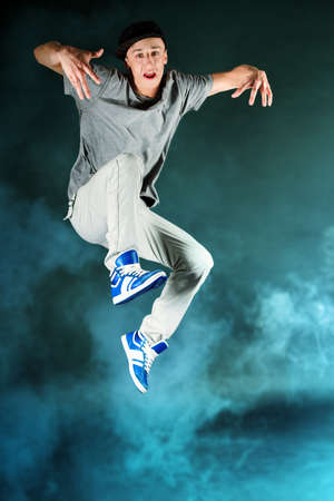 Young man dancing hip-hop at studio.の写真素材