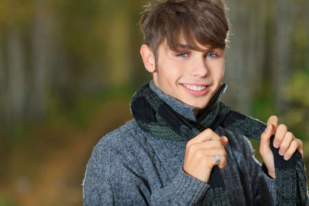 Happy young man posing outdoor.の写真素材