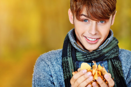 Happy young man posing outdoor.