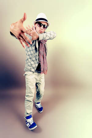 Young man dancing hip-hop at studio.の写真素材