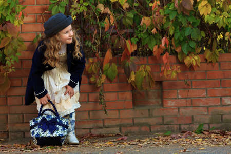 Shot of a cute girl walking at the park. Retro style. の写真素材