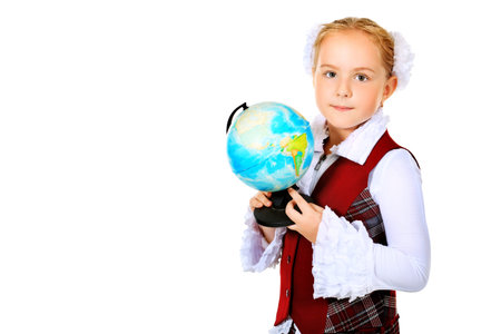 Portrait of a cute schoolgirl with a globe. Isolated over white background.の写真素材