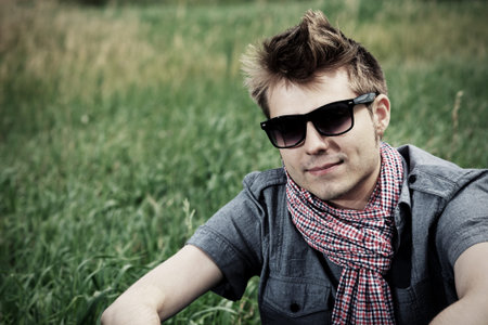 Portrait of a handsome young man posing outdoor.