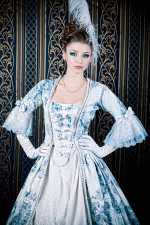 Portrait of the elegant woman in medieval era dress. 